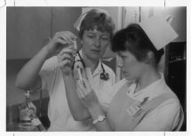 Nursing instructor and student, date unknown