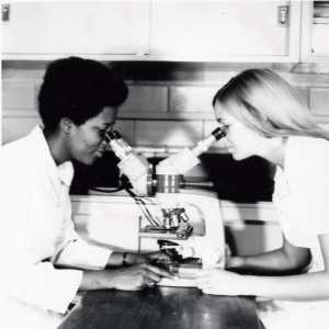 n.d. - Women are often not given the proper encouragement to study science and/or technology programs. In this undated picture, two female students look at specimens under a microscope. 