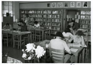 ca 1976 – The original campus library was on the second floor of the main building, where the Writing Center lab is now located. By the mid-1970s, increased enrollment necessitated a larger library, and construction began to convert the Courter Tech auditorium into the Library Resources Center. 